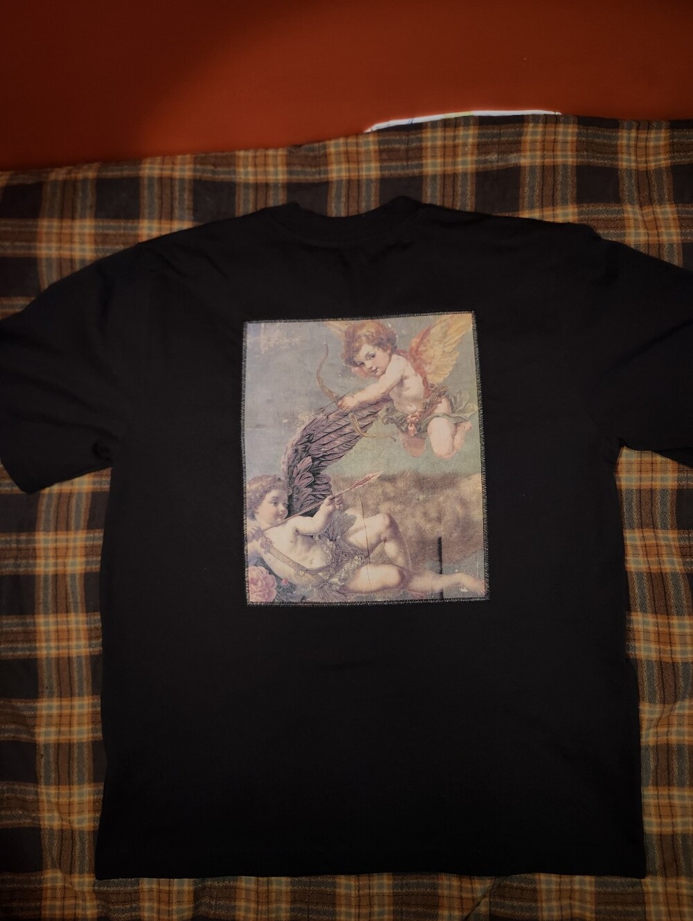 Vox Populi dark graphic tee with "mood" design and "Cherubs"